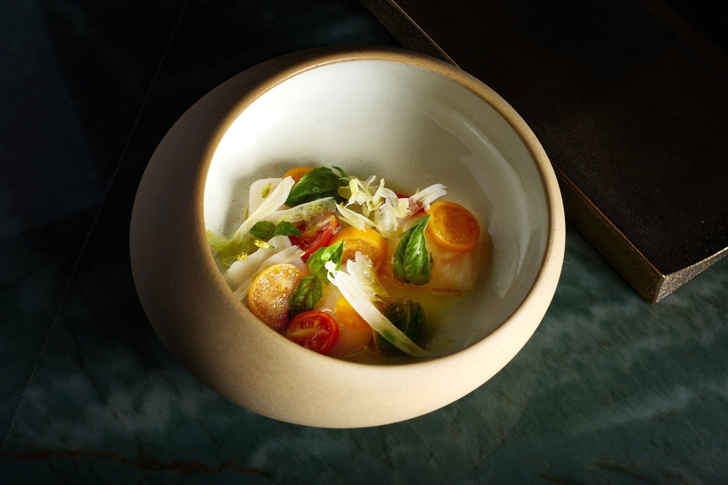 Seasonal vegetable course in a ceramic bowl
